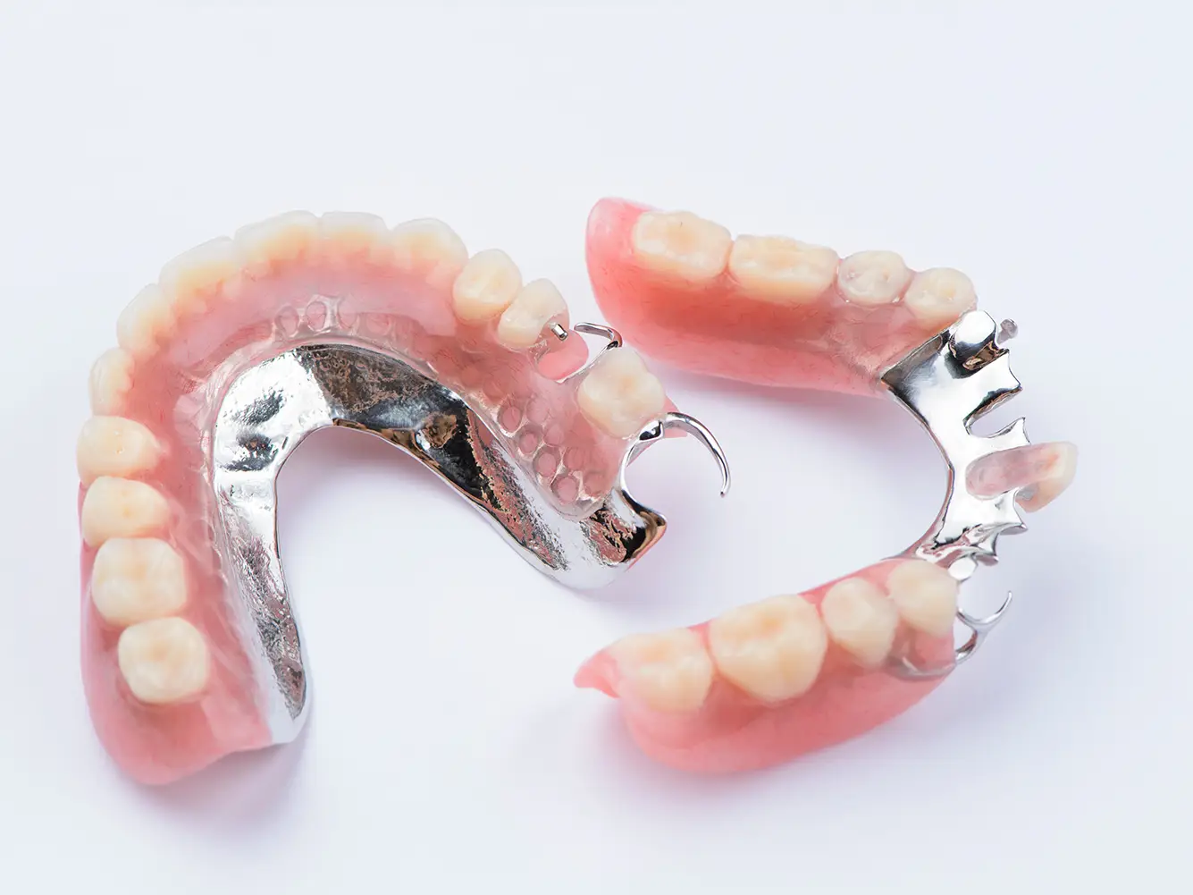 a close up of a partial denture on a white surface
